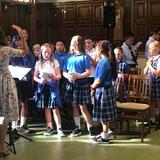 Our Lady Of Mt Carmel School Photo #2 - School choir performing at the monthly all school mass in Our Lady of Mount Carmel Church (across the playground from the school building).