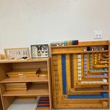 Peninsula Montessori School - Palos Verdes Campus Photo #3 - Montessori bead chains and math materials on classroom shelves