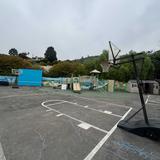 Peninsula Montessori School - Palos Verdes Campus Photo #10 - Outdoor blacktop, basketball hoop and play structures