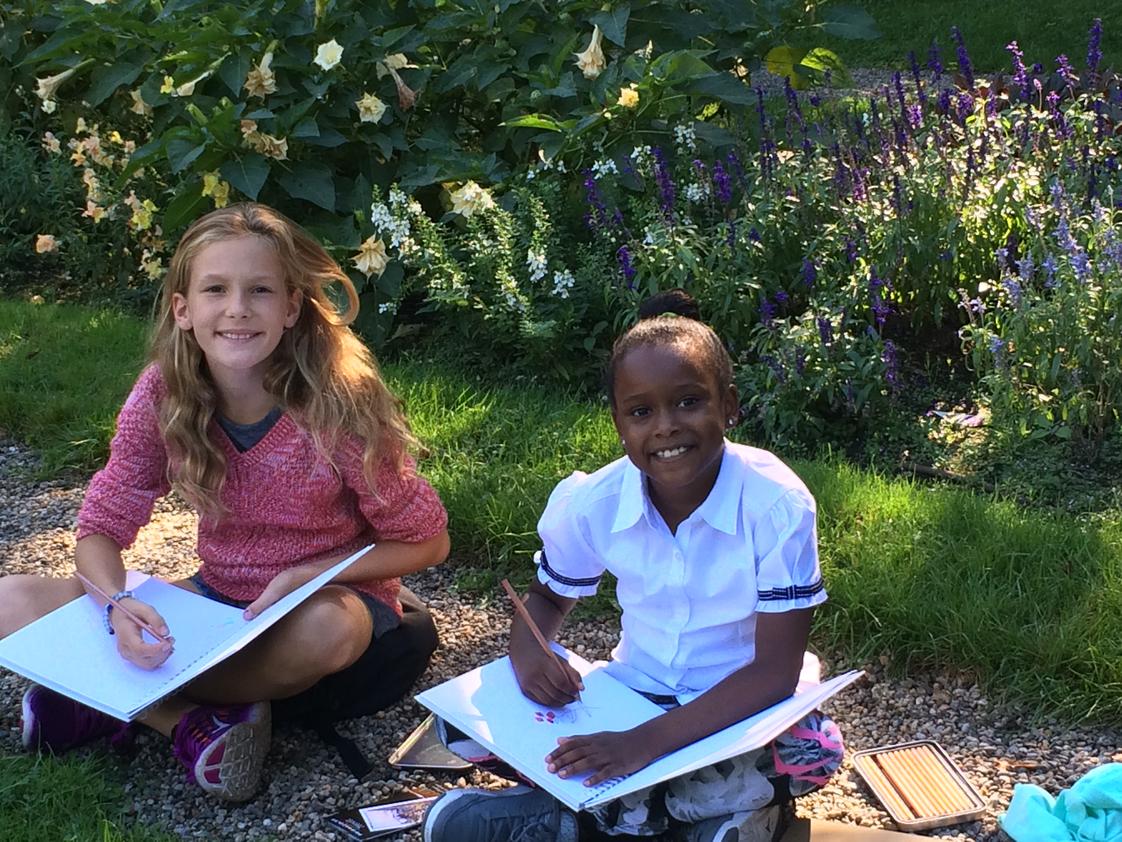 The Phoenix School Photo #1 - Getting outdoors is important part of a Phoenix education. Here, we're using one of the Peabody Essex Museum's historic houses with a beautiful garden to be bontanists, taking notes and drawing the flowers we see. Later we will add notes about the parts and their functions of each flower/plant we draw.