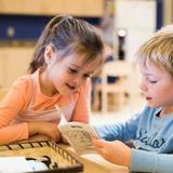 Montessori ONE Academy Photo #7 - Independent reading in the Primary Class.