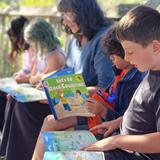 Crestmont School Photo #2 - Our second/ third grade enjoying the beautiful weather while reading on the deck.