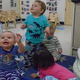 Monroe KinderCare Photo #5 - Our babies are working on their eye hand coordination during Bubble Play!!!