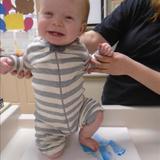 Monroe KinderCare Photo #3 - Our babies engage in many different sensory activities throughout the day. Here is James enjoying getting his foot painted for a footprint art project.