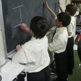 St. Scholastica HSC Academy Photo #2 - Students spend lots of time at the chalk boards, white boards, and smartboards as they learn.