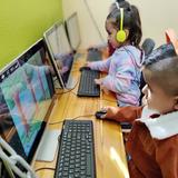Kids Adventure Learning Center Photo #14 - STEAM in action! The computer lab in our Orange Classroom allows our students to experience more than a touch screen but how to use a keyboard and mouse, which is rapidly becoming common place in Elementary School.