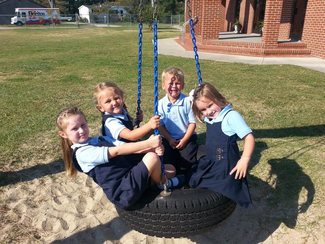 Wanchese Christian Academy Photo #1 - Preschoolers are enjoying their morning break on the tire swing. First the calandar and days weather, then Bible class followed by Numbers. Finally, snack time with recess to follow. Then back to class for letters, science and crafts!