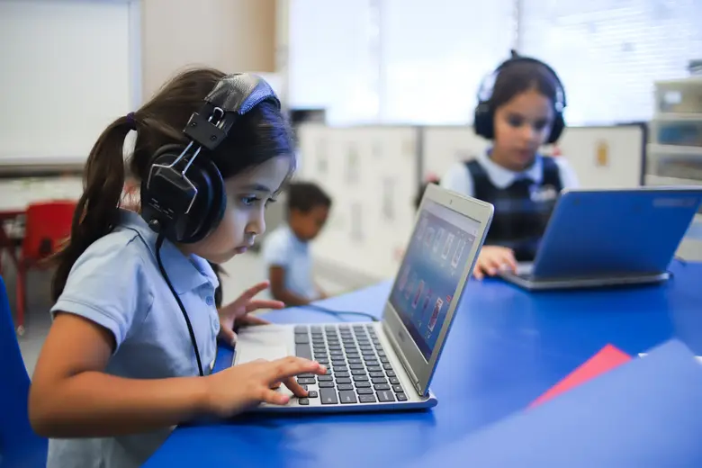 Pillars Academy Photo #2 - Kindergartners engaged in Raz kids online reading program!