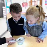 Guardian Angels Regional School Photo #4 - Hands-on science in 1st grade.