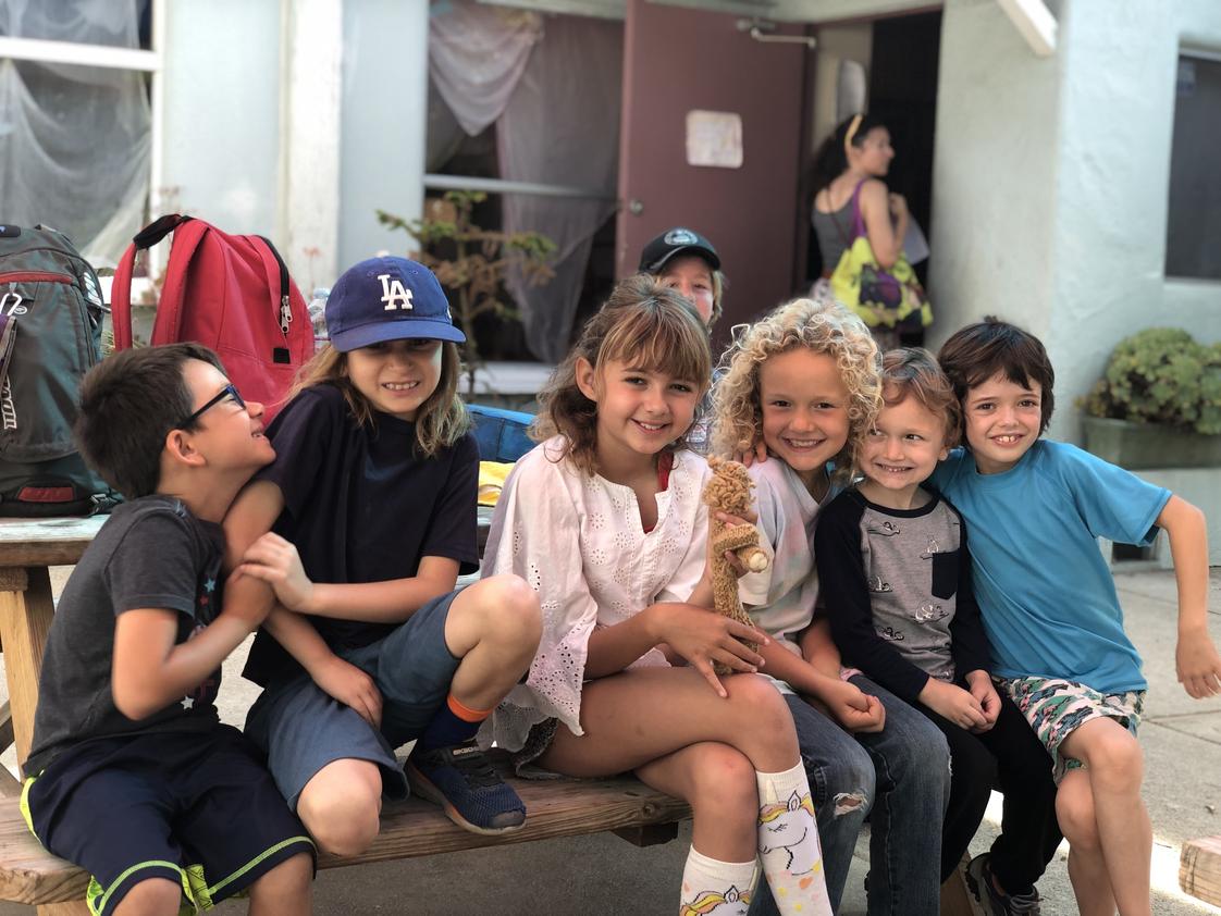 Valley Waldorf City School Photo #1 - A group of 2nd grade students sharing snacks on the yard together during the 2019 school year.