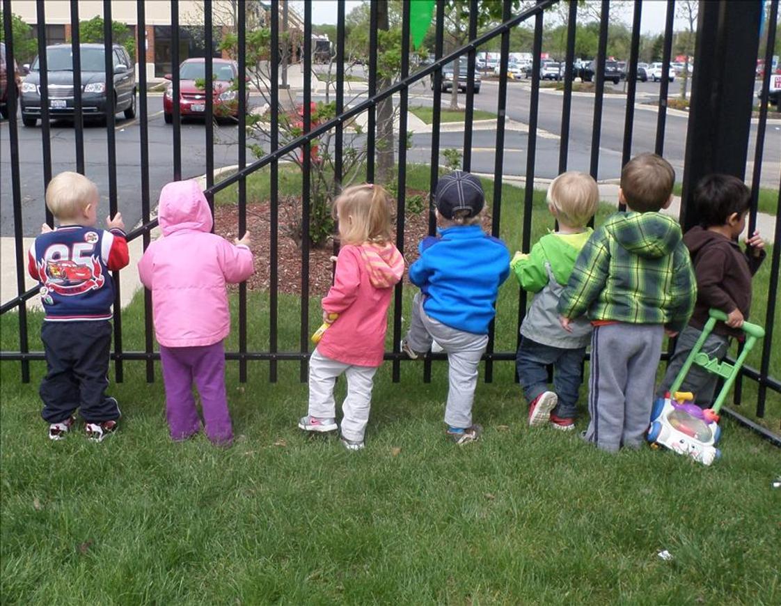 Hoffman Estates KinderCare Photo - The playground is a great place to explore and play and sometimes we see really cool things like garbage trucks, school busses and more things that pass by!