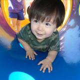 East Roselle KinderCare Photo #4 - The children in our Toddler Program have fun crawling through the tunnels on the playground outside! This activity encourages them to develop controlled movements through play.