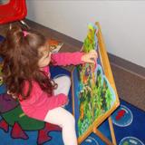 West Schaumburg KinderCare Photo #3 - PreKindergarten focuses on many areas including problem solving while learning to complete puzzles.