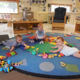 New Lenox KinderCare Photo #4 - In the Infant room a we are making friends and teaching them how to sit!