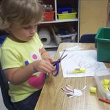 New Lenox KinderCare Photo #8 - Learning to cut in the Preschool Room.