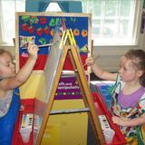 Telegraph Road KinderCare Photo #10 - Easel painting in the Preschool classroom.