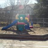 Silver Spring KinderCare Photo #6 - The Toddler/Discovery Preschool playground has push toys, cars and other mobile equipment to help the children develop their gross motor skills. There is also an area for group games and sensory exploration.