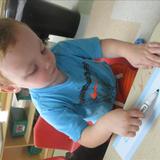 St. Joseph KinderCare Photo #8 - A two year old working on writing his name.