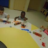 Mt. Holly KinderCare Photo #3 - Toddlers creating rain sticks