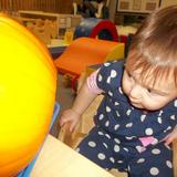 West Cedar Rapids KinderCare Photo #9 - Infant trying to see what is in a pumpkin