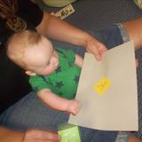 West Cedar Rapids KinderCare Photo #6 - Infant is being exposed to literacy.