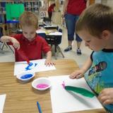 Mentor South KinderCare Photo #8 - Preschoolers Painitng with Feathers
