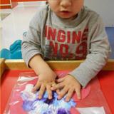 Green Oaks KinderCare Photo #3 - Toddlers making butterflies in class