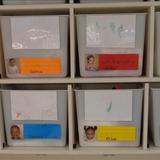 KinderCare at Meadowbrook Photo #10 - Preschool Classroom Cubbies, the children drew their self-portraits and also wrote their name to label their own personal cubby
