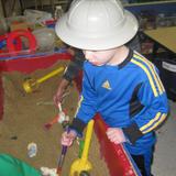 Newington KinderCare Photo #9 - Here you can see our Preschool classrooms participating in a â€œPaleontologist Digâ€ where the children are encouraged to dig for fossils and then brush off the sand to identify what type of fossil they found. During their Dinosaur unit the children learn all about Dinosaurs and the era in which they existed.