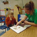 Elmhurst KinderCare Photo #6 - In our Preschool classroom our teachers model reading and writing daily in a variety of activities including read-alouds and charting.