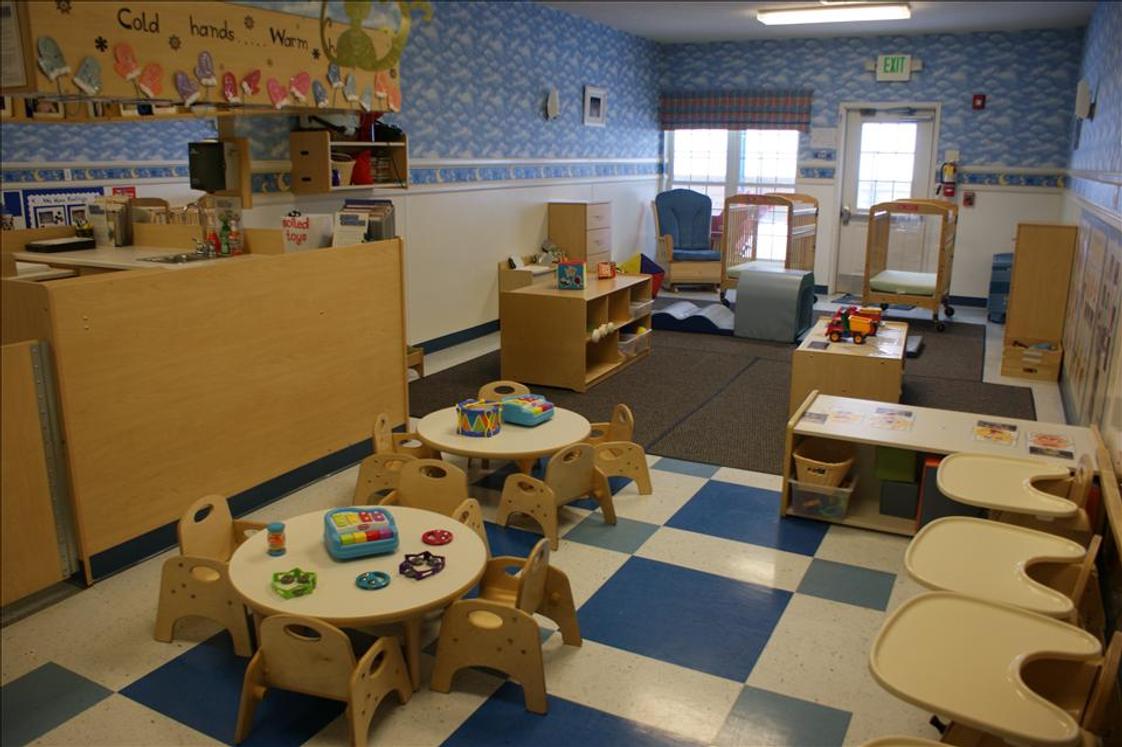 Kinder Care Learning Center Photo - Welcome to the Infant Room! Your infant will learn a wide array of things during the day with us, engaging in activities such as using the five senses to explore the world all around him or her, experimenting with toy instruments, developing memory skills and interacting with other children.