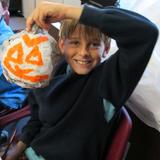 The Willow School Photo #4 - Making papier mache pumpkins in art class.