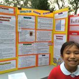 Hilldale School Photo #3 - A student is ready to answer questions about her Science Fair project.