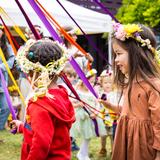 Westside Waldorf School Photo #15 - Celebrations and festivals are part of the fabric of life at a Waldorf school. Here, children celebrate the May Pole festival each spring, with ribbon dances and handmade flower crowns.