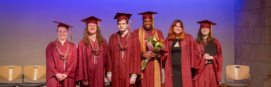 Temple Grandin School Photo #1 - TGS Graduates on stage during a graduation ceremony.