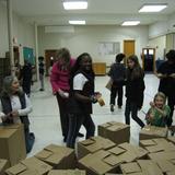 Charlotte Mason Community School Photo #2 - The 4th-8th graders helped put together boxes for the Boxes of Love food baskets for the needy.