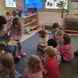 Puddletown Montessori School Photo #5 - Elementary learners read to the preschool-kindergartners weekly