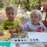 Live Oak Montessori School Photo #9 - The children are enjoying beautiful weather while creating their artwork