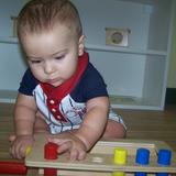 Live Oak Montessori School Photo #3 - And here our 8 month old working on his eye-hand coordination.