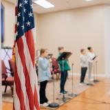 Grace Covenant Baptist Academy Photo #2 - Each day begins with our pledges to the US Flag, Christian Flag, and God's Word, the Bible.