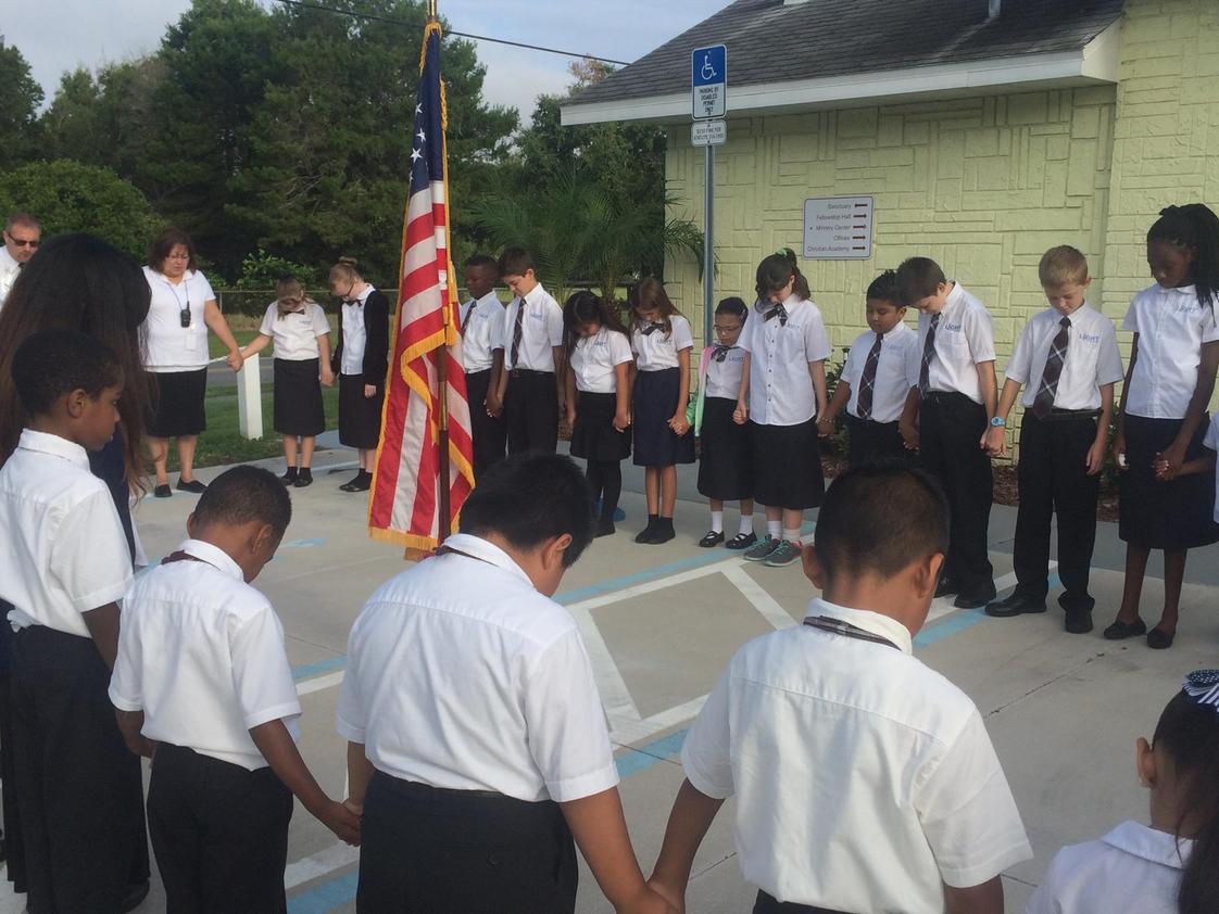 Light Christian Academy Photo #1 - LCA students praying for our nation during chapel (2015-2016 school year)