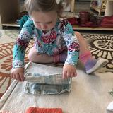 Indiana Montessori Academy Photo #9 - An IMA toddler student folds the laundry.