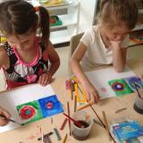 Montessori School at Lone Tree Photo - Kindergarten children learn about artists. In this photo, they are painting in a style similar to Wassily Kandinsky.