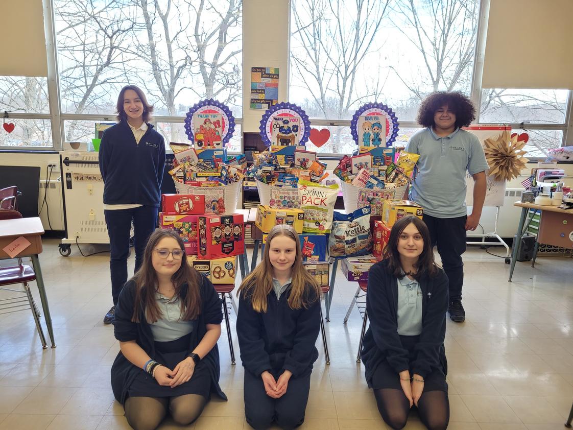 St. Luke Catholic School Photo #1 - Service to the community is of great importance in our school. Here, our 7th grade class has collected and prepared snacks to give to Southington's First Responders in support of their work.