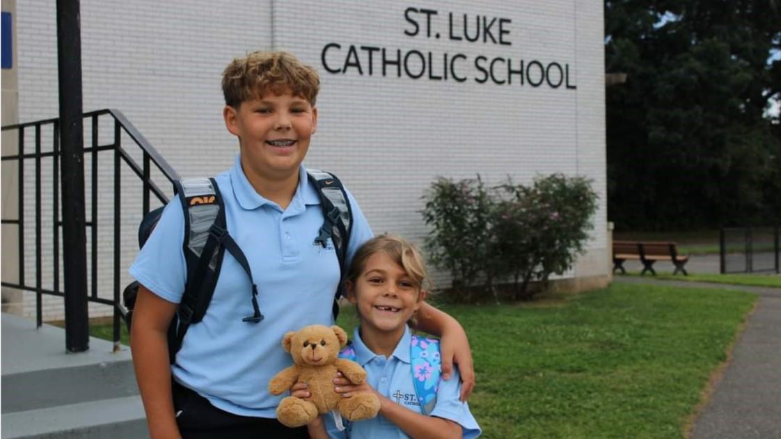 St. Luke Catholic School Photo - Our students are welcomed by the Principal every morning with a high five as he holds the door open for them.