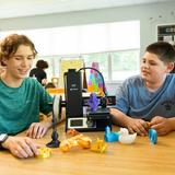 Wilmington Montessori School Photo #2 - Middle School students use a 3D printer in the Maker (STEAM) Studio.