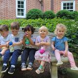 Aidan Montessori School Photo #4 - Aidan's toddler friends share a snack break outside