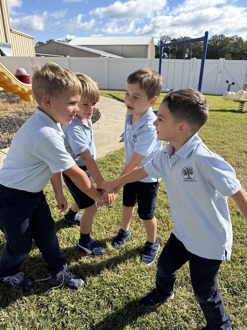 Adolesco Preparatory Academy Photo - Kinders playing super hero at recess.