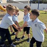 Adolesco Preparatory Academy Photo - Kinders playing super hero at recess.