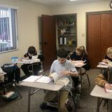 Gulf Coast Classical Academy Photo - GCCA students in class. We provide a tech-free environment and small class sizes.